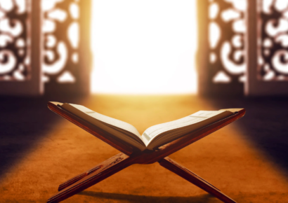 A Quran on Rihal and light coming straight on it