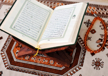 beautiful Quran on prayer matt with tasbeeh